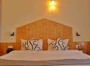 Voodi või voodid majutusasutuse Bayith Cafe and Stay toas