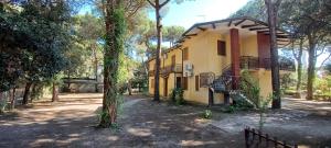 a house in the middle of a forest at Bright flat in Rosolina in Rosolina Mare