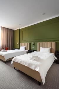 Ένα ή περισσότερα κρεβάτια σε δωμάτιο στο GRAND OPERA HOTEL +101 φωτογραφίες