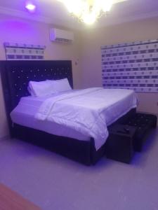 Postel nebo postele na pokoji v ubytování Frills Apartments