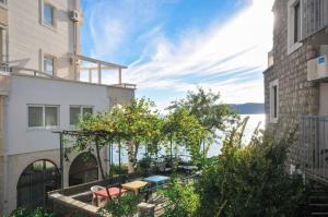 a balcony of a building with a view of the water at Apartments Milos Kaladjurdjevic in Budva