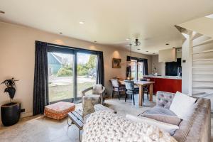 a living room with a couch and a table at Luxury private farmhouse cottage near Amsterdam plus home cinema in Ilpendam