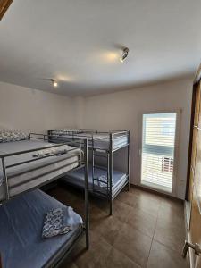 Ένα ή περισσότερα κρεβάτια σε δωμάτιο στο Chalet frente al Mar