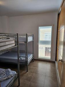 Ένα ή περισσότερα κρεβάτια σε δωμάτιο στο Chalet frente al Mar