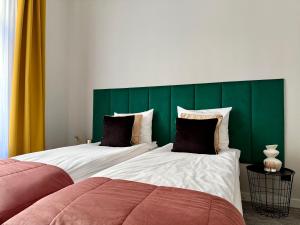 Postel nebo postele na pokoji v ubytování Milla Apartments