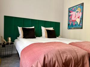 Postel nebo postele na pokoji v ubytování Milla Apartments
