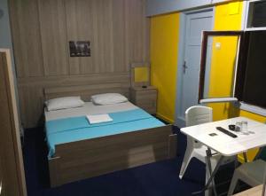 Postel nebo postele na pokoji v ubytování Yeni Yıldız Otel