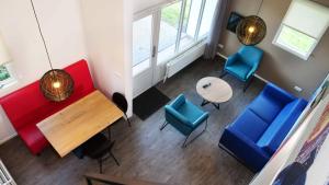 an overhead view of a room with chairs and a table at Walibi Village in Biddinghuizen +8 photos