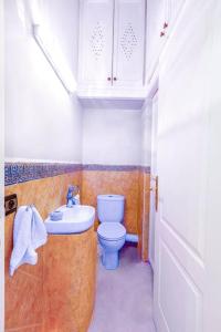 a small bathroom with a toilet and a sink at Villa YOGA Guéliz Centre-Ville in Marrakech +18 photos