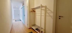 a hallway with a spiral staircase in a house at Apartment Bergblick by Alpenidyll Apartments in Weißenbach
