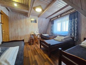 Posteľ alebo postele v izbe v ubytovaní Willa u Renaty - Widok na Giewont