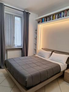 Ένα ή περισσότερα κρεβάτια σε δωμάτιο στο Atene Bilocale in affitto breve