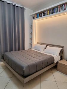 Ένα ή περισσότερα κρεβάτια σε δωμάτιο στο Atene Bilocale in affitto breve