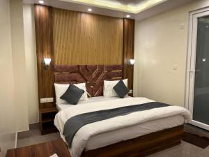 Voodi või voodid majutusasutuse Hotel Grand Safari toas