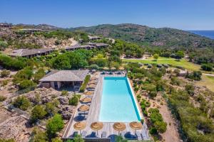 an aerial view of a pool at a resort at Résidence Les Terrasses de Rondinara in Bonifacio