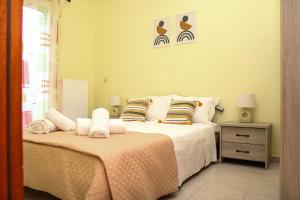 Ένα ή περισσότερα κρεβάτια σε δωμάτιο στο Villa Sunrise apartment