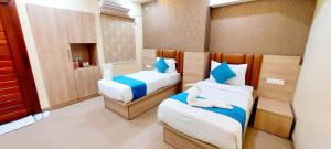 Postel nebo postele na pokoji v ubytování Hotel Ananda Kashi + 32 fotografií