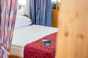 Ένα ή περισσότερα κρεβάτια σε δωμάτιο στο Hotel Vorab - Kulinarische Vielfalt