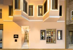a series of three photos of a building at Hotel Des Arts Galata in Istanbul
