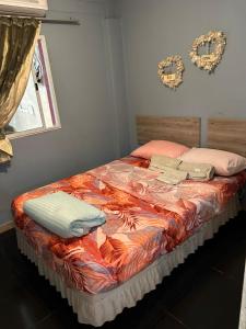 a large bed with pillows on it in a bedroom at "Edificio Don Luis" en Bajada Vieja in Posadas