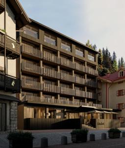 an apartment building with wooden balconies and a courtyard at Casa Cook Madonna in Madonna di Campiglio