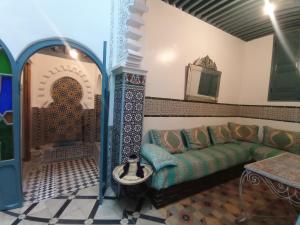 a living room with a couch and a table at Maison De La Lune in Tétouan +68 photos