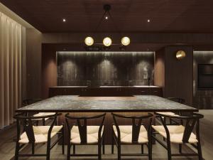 a dining room with a large table and chairs at illi Gran Azabujuban in Tokyo