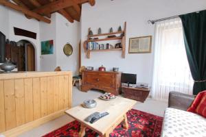 a living room with a couch and a table at Apartment Cign OG in Celerina