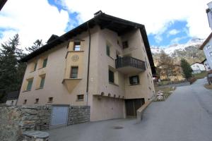 a building with a balcony on the side of it at Apartment Christina in Pontresina