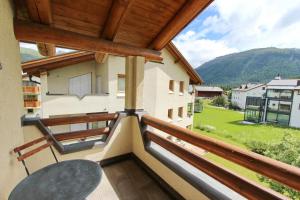 a view from the balcony of a house at Apartment Cign OG in Celerina +2 photos