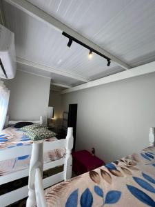a bedroom with two bunk beds and a white ceiling at Instituto Aterra OUT in Porto Alegre