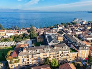 an aerial view of a town by the water at Marriott CIAO LAGO Family Apartment DesenzanoLoft Official Partner Homes & Villas by Marriott Bonvoy in Desenzano del Garda