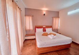 Postel nebo postele na pokoji v ubytování Cucuu Nest Villa Coonoor by VOYE HOMES