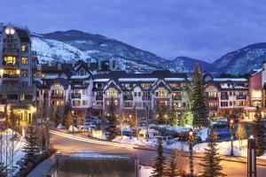 a town in the mountains at night with snow at Lion Square Lodge North 296 in Vail