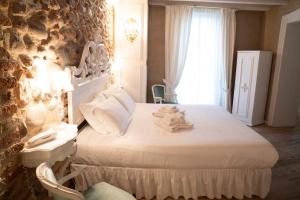 Posteľ alebo postele v izbe v ubytovaní Regia Rosetta - Royal Rooms Borghetto