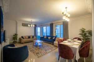 a living room with a table and chairs at Skyline Premium Properties in Alexandria