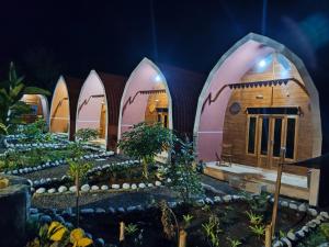 a model of a house with a garden at Indah Damai Cottages in Sidomukti