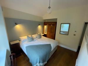 Letto o letti in una camera di The Arch House