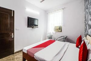 Μια τηλεόραση ή/και κέντρο ψυχαγωγίας στο Hotel O Silver Coin Residency