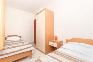 Postel nebo postele na pokoji v ubytování Apartments Brane