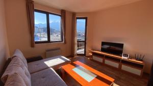 TV a/nebo společenská místnost v ubytování Snow Lodge Mountain view + 9 fotografií