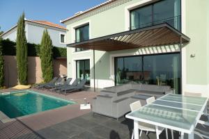 Swimmingpoolen hos eller tæt på Villa Eden Nature in Prazeres