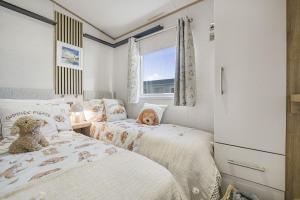 Voodi või voodid majutusasutuse Seaview Holiday Let - Vale Holiday Park at Cardiff Airport toas
