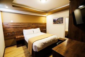 Voodi või voodid majutusasutuse INKALAM cusco toas