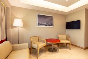Телевизор и/или развлекательный центр в Radisson Blu Hotel, Doha