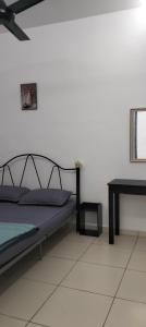 Ένα ή περισσότερα κρεβάτια σε δωμάτιο στο Nice House At Alor Gajah near UITM UTEM