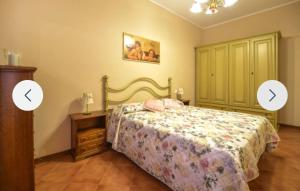 two images of a bedroom with a bed and a dresser at Casa Martina in Camaiore