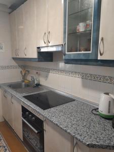 a kitchen with a sink and a counter top at Casa Hontoba in Hontoba