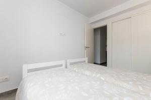 Postel nebo postele na pokoji v ubytování YourHouse Can Cortana