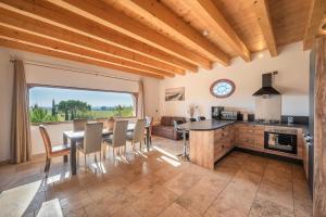 a kitchen and dining room with a table and chairs at Vacation rental with pool and Jacuzzi, close to Arles - sleeps 10 in Arles
